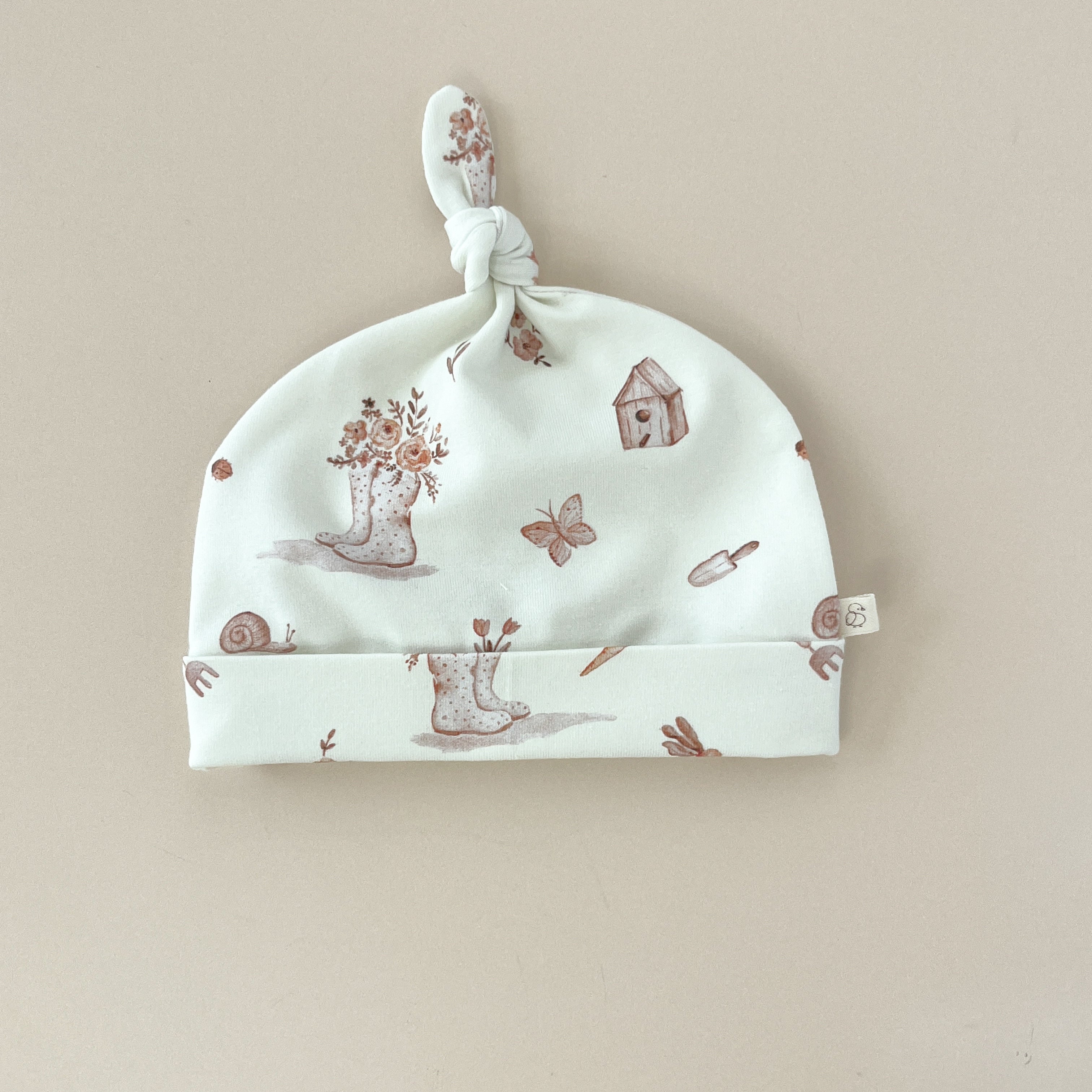 Bonnet bébé fille à nœud – Jersey motif Jardin Fleuri